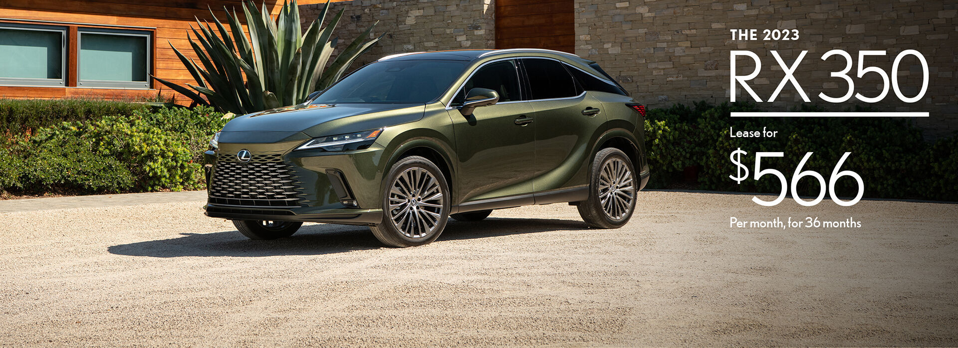 Nori green 2023 RX 350 parked in front of home.