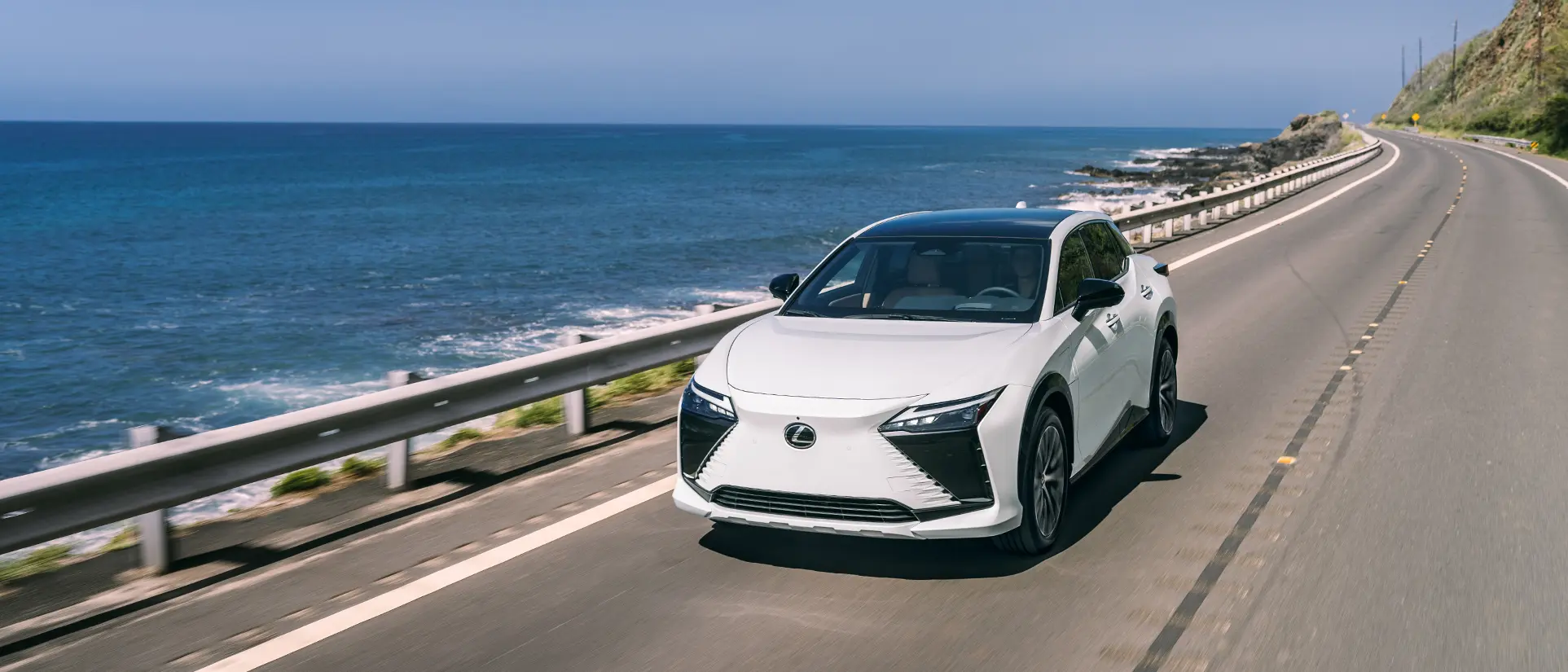 Lexus RZ 450e Luxury shown in Eminent White Pearl in driveway