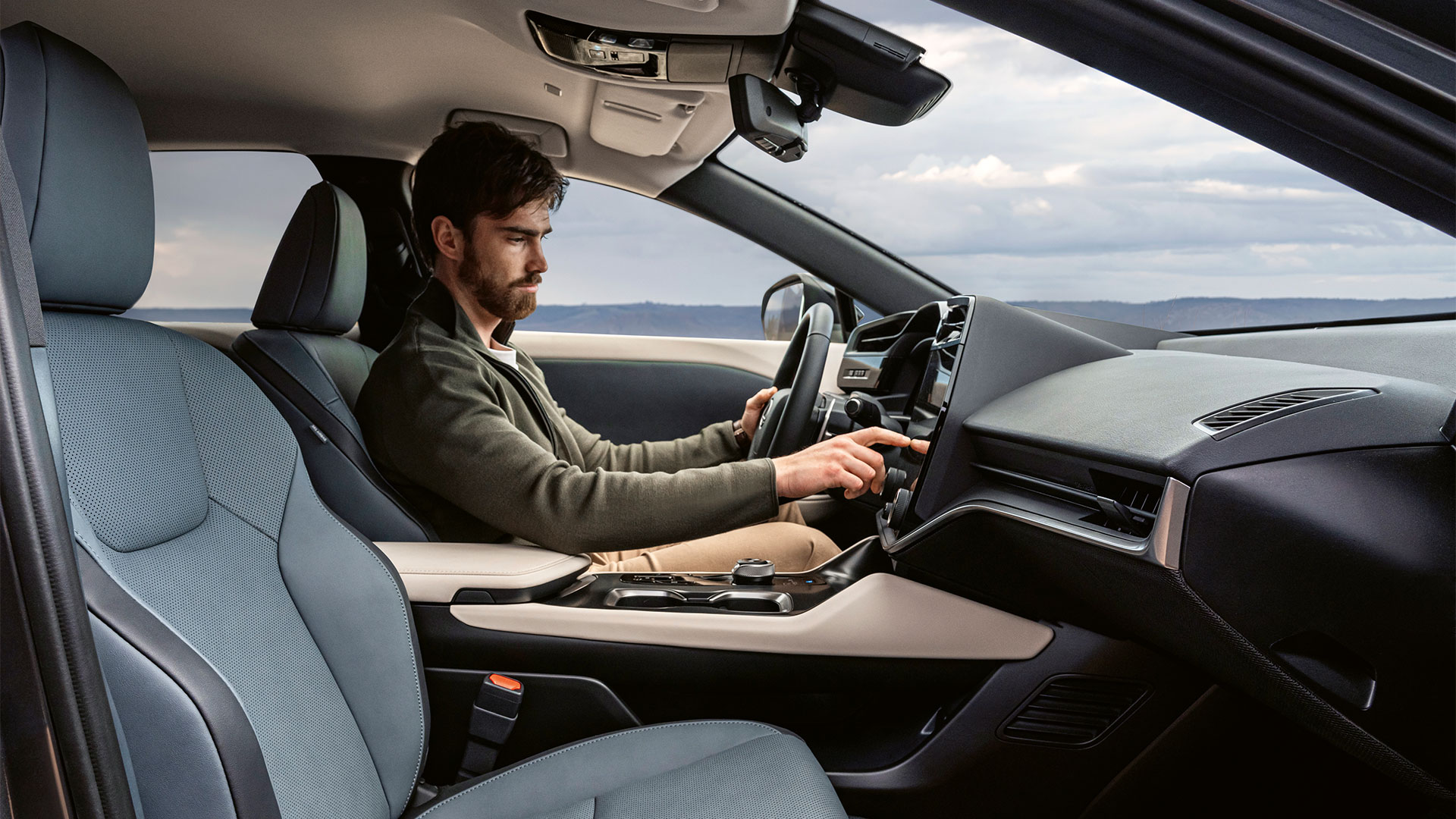 Man inside RZ showing luxurious seating and clean design