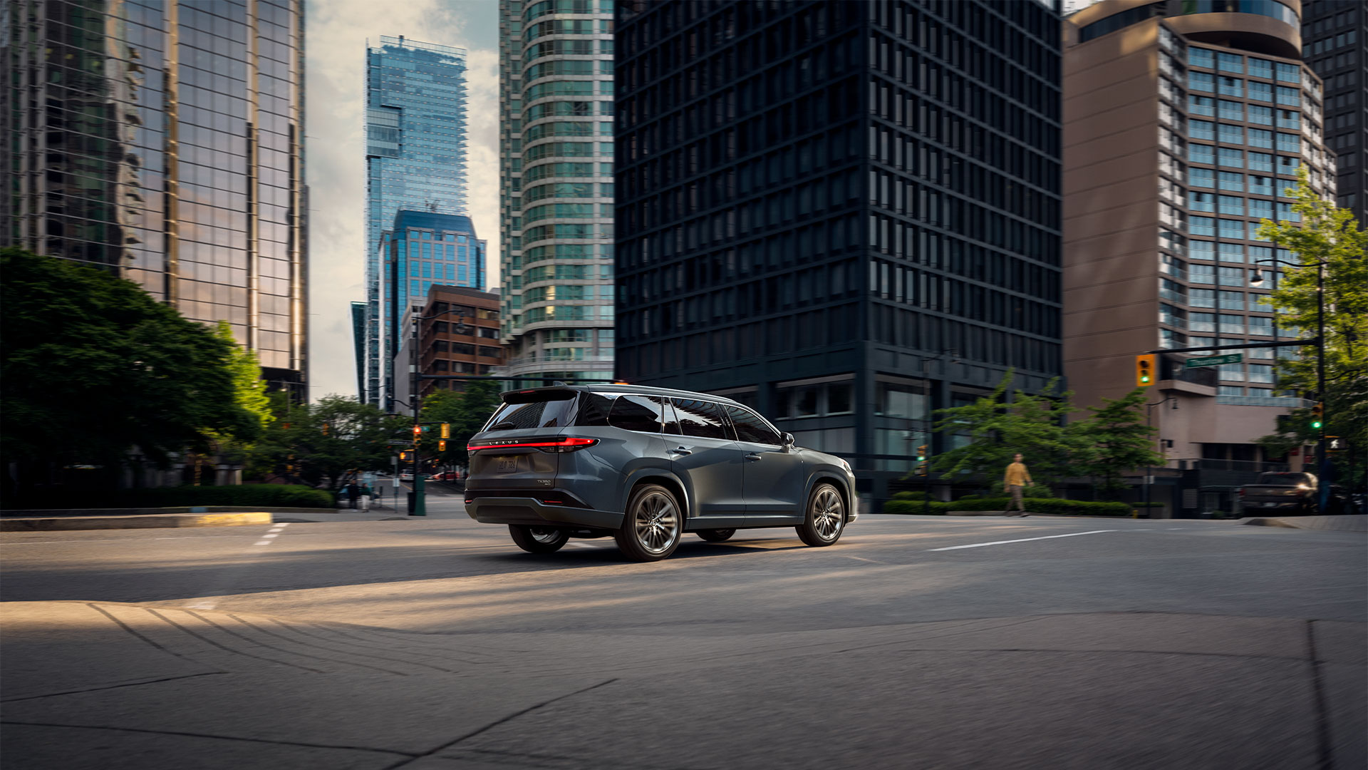 2026 Lexus TX 350 shown in Nightfall Mica driving on a highway 