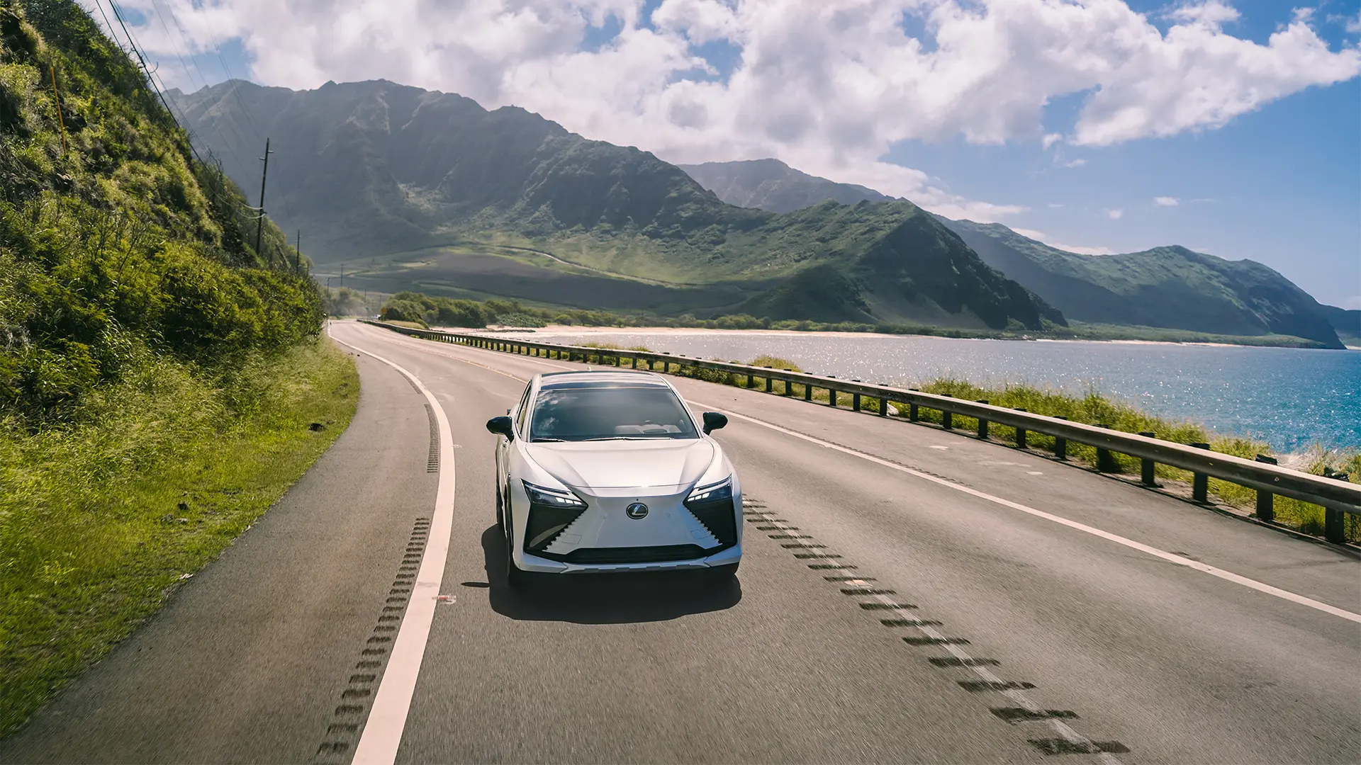 2026 RZ driving along two-way highway.