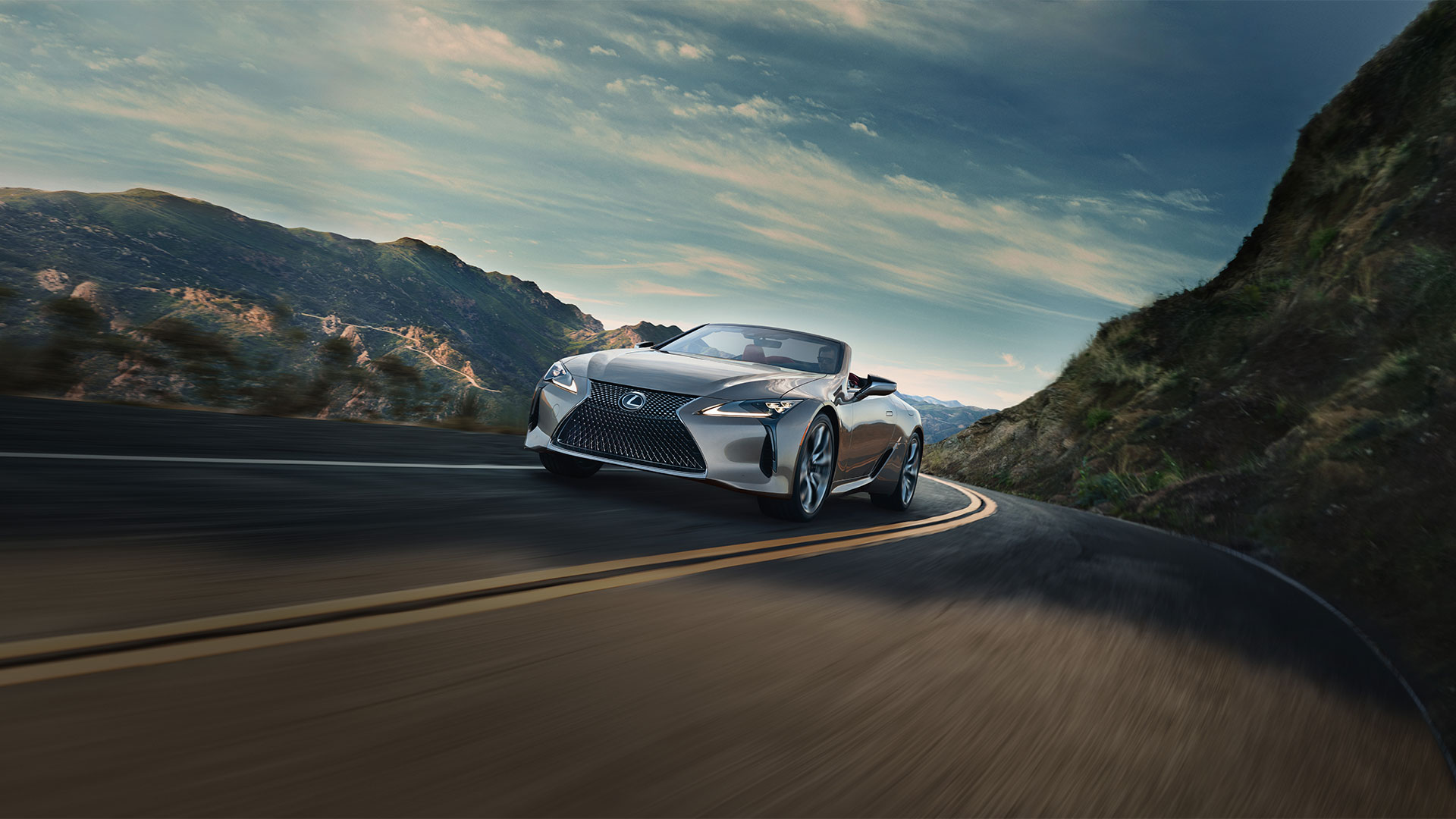 LC 500 Convertible Iridium driving on road.