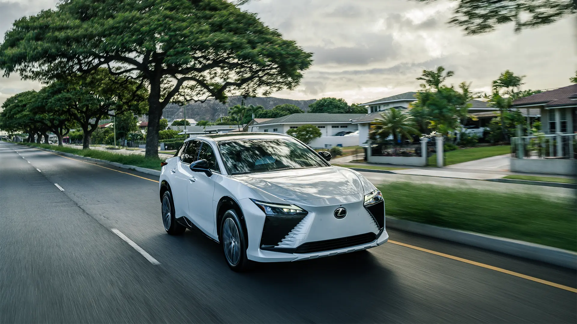 2025 RZ driving through suburban neighborhood