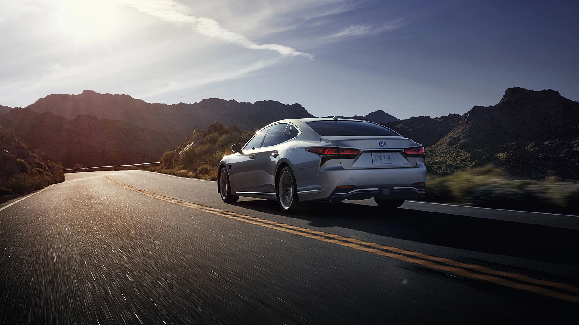 LS 500 Driving on Road with Mountain Background