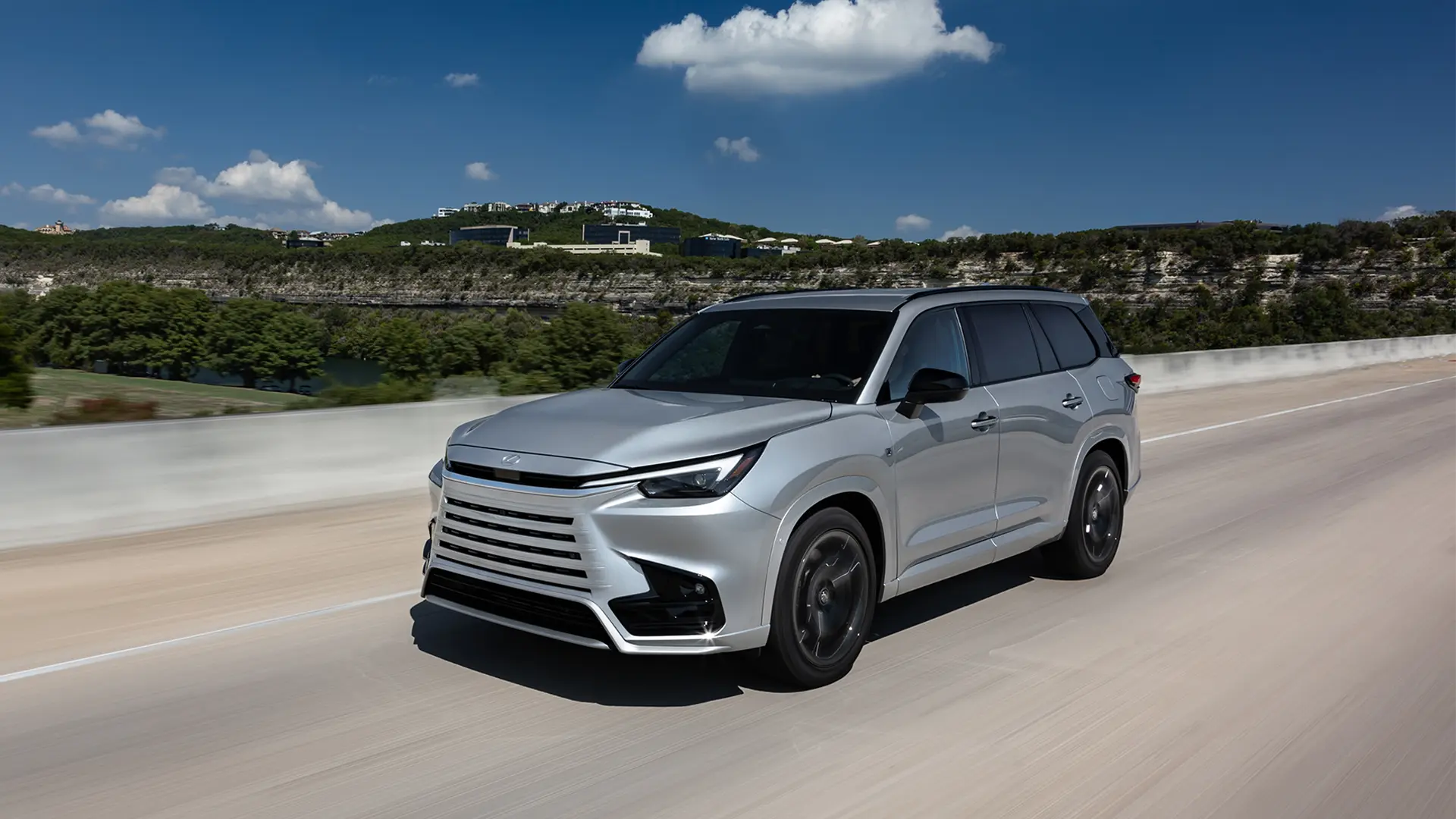 TX 500h F SPORT driving on road.