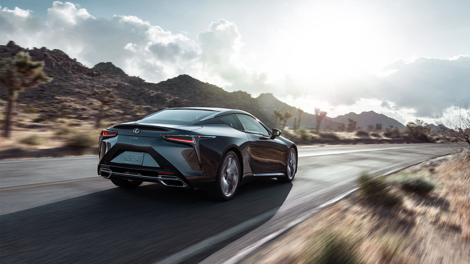 LC 500 driving on rural road.